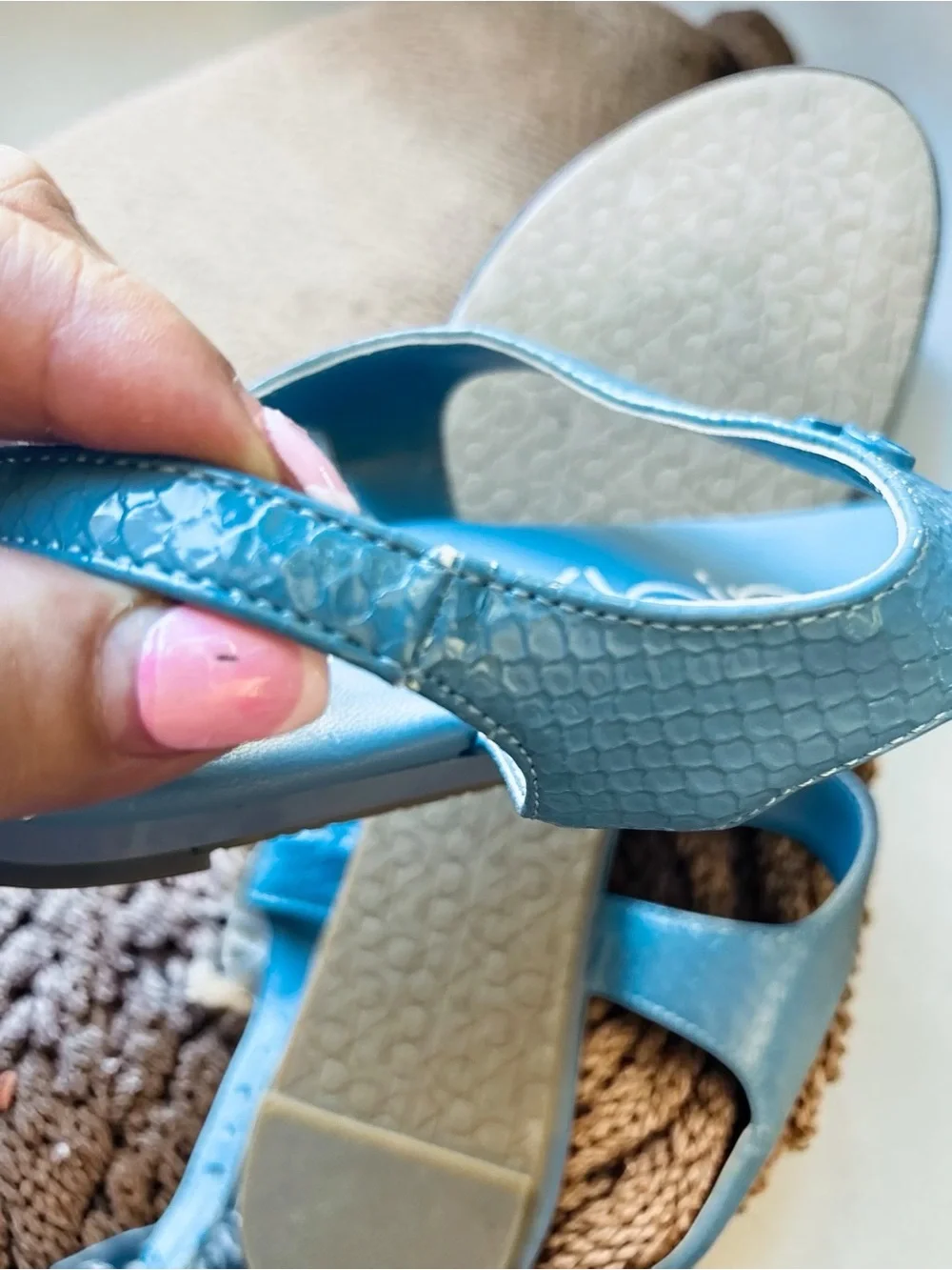 Calvin Klein Shellie blue snake print flat thong sandals feature an ankle strap
